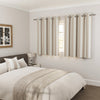 Henley Natural curtains in a bedroom