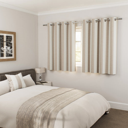 Henley Natural curtains in a bedroom